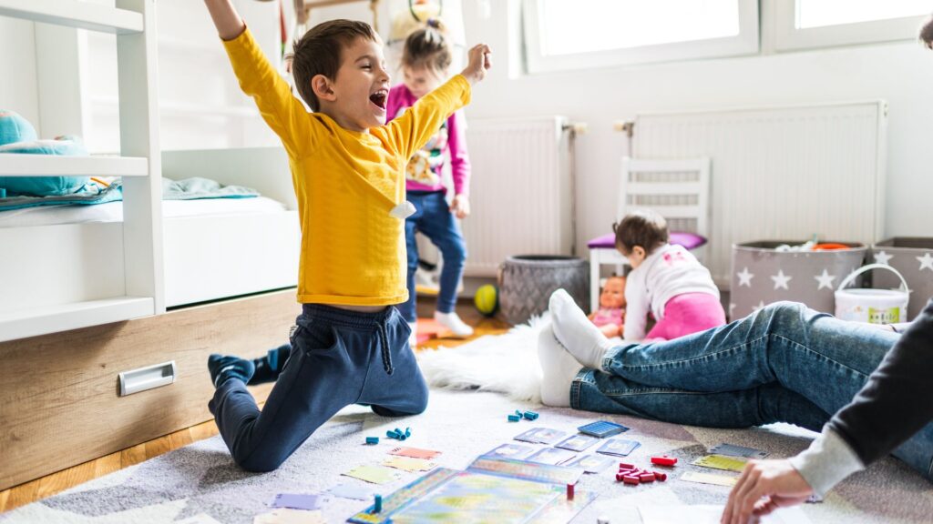 Child celebrates demonstrating the link between autism and play